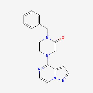 molecular formula C17H17N5O B12267546 1-Benzyl-4-{pyrazolo[1,5-a]pyrazin-4-yl}piperazin-2-one 