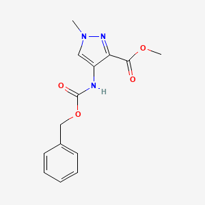 molecular formula C14H15N3O4 B12283832 Methyl 4-(Cbz-amino)-1-methyl-1H-pyrazole-3-carboxylate 