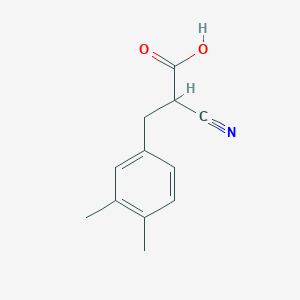 molecular formula C12H13NO2 B12289662 2-Cyano-3-(3,4-dimethylphenyl)propionic Acid 