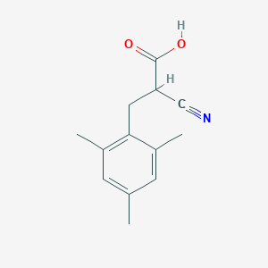 molecular formula C13H15NO2 B12335443 2-Cyano-3-(2,4,6-trimethylphenyl)propionic Acid CAS No. 2044707-18-6