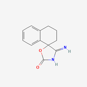 molecular formula C12H12N2O2 B12352957 4-iminospiro[1,3-oxazolidine-5,4'-2,3-dihydro-1H-naphthalene]-2-one 