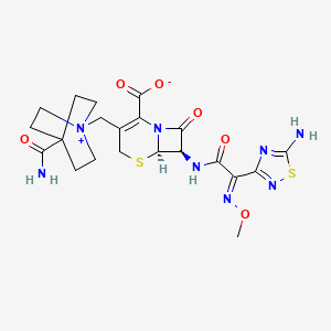 molecular formula C21H26N8O6S2 B1235520 (6R,7R)-7-[[(2E)-2-(5-amino-1,2,4-thiadiazol-3-yl)-2-methoxyiminoacetyl]amino]-3-[(4-carbamoyl-1-azoniabicyclo[2.2.2]octan-1-yl)methyl]-8-oxo-5-thia-1-azabicyclo[4.2.0]oct-2-ene-2-carboxylate 