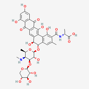 B1239308 D-Alanine, N-(((5S,6S)-5-((4,6-dideoxy-4-(methylamino)-3-O-beta-D-xylopyranosyl-beta-D-galactopyranosyl)oxy)-5,6,8,13-tetrahydro-1,6,9,11,14-pentahydroxy-3-methyl-8,13-dioxobenzo(a)naphthacen-2-yl)carbonyl)- CAS No. 152880-68-7