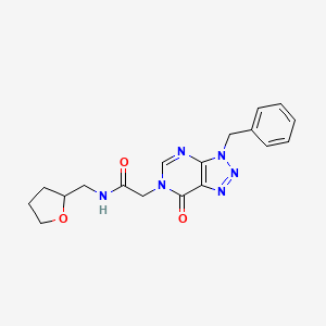 molecular formula C18H20N6O3 B1239746 N-(2-oxolanylmethyl)-2-[7-oxo-3-(phenylmethyl)-6-triazolo[4,5-d]pyrimidinyl]acetamide 