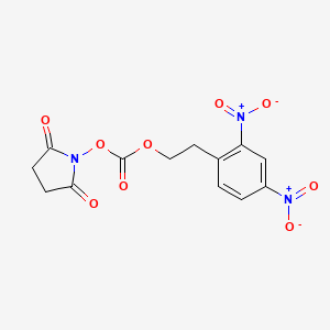 B12558892 1-({[2-(2,4-Dinitrophenyl)ethoxy]carbonyl}oxy)pyrrolidine-2,5-dione CAS No. 144481-13-0