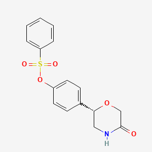 4-[(2S)-5-Oxomorpholin-2-yl]phenyl benzenesulfonate