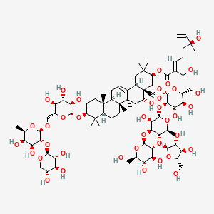 molecular formula C80H128O39 B1264066 [(2S,3R,4S,5S,6R)-3-[(2S,3R,4S,5S,6S)-5-[(2S,3R,4R,5S)-3,4-dihydroxy-5-(hydroxymethyl)oxolan-2-yl]oxy-3-hydroxy-6-methyl-4-[(2S,3R,4S,5S,6R)-3,4,5-trihydroxy-6-(hydroxymethyl)oxan-2-yl]oxyoxan-2-yl]oxy-4,5-dihydroxy-6-(hydroxymethyl)oxan-2-yl] (3S,4aR,5R,6aR,6aS,6bR,8aR,10S,12aR,14bS)-10-[(2R,3R,4S,5S,6R)-6-[[(2R,3R,4S,5R,6R)-4,5-dihydroxy-6-methyl-3-[(2S,3R,4S,5R)-3,4,5-trihydroxyoxan-2-yl]oxyoxan-2-yl]oxymethyl]-3,4,5-trihydroxyoxan-2-yl]oxy-5-hydroxy-3-[(2E,6S)-6-hydroxy-2-(hydroxymethyl)-6-methylocta-2,7-dienoyl]oxy-2,2,6a,6b,9,9,12a-heptamethyl-1,3,4,5,6,6a,7,8,8a,10,11,12,13,14b-tetradecahydropicene-4a-carboxylate 