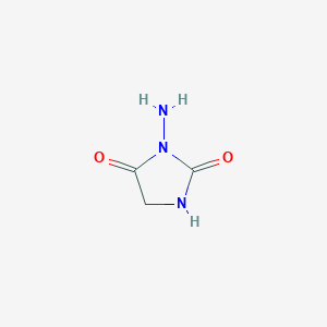 molecular formula C3H5N3O2 B1273386 3-Aminoimidazolidine-2,4-dione CAS No. 19279-78-8