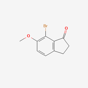 molecular formula C10H9BrO2 B1273434 7-溴-6-甲氧基-2,3-二氢-1H-茚-1-酮 CAS No. 892152-26-0