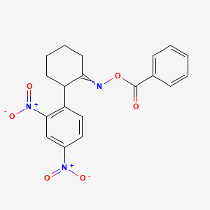 molecular formula C19H17N3O6 B1275375 1-{2-[(Benzoyloxy)imino]cyclohexyl}-2,4-dinitrobenzene 