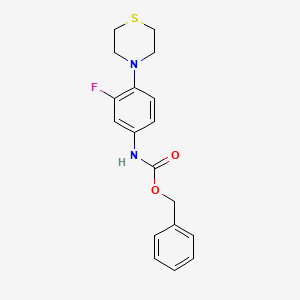molecular formula C18H19FN2O2S B1278574 N-[3-氟-4-(硫代吗啉-4-基)苯基]甲酰苯甲酯 CAS No. 168828-71-5