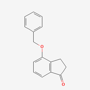 molecular formula C16H14O2 B1282477 4-(苄氧基)-2,3-二氢-1H-茚-1-酮 CAS No. 86045-82-1