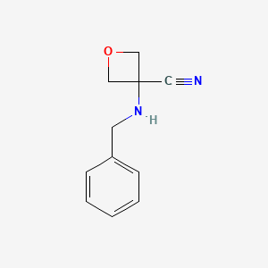 molecular formula C11H12N2O B1283558 3-(ベンジルアミノ)オキセタン-3-カルボニトリル CAS No. 138650-20-1