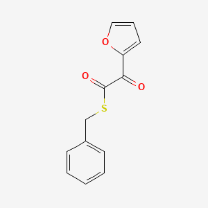 molecular formula C13H10O3S B12843658 2-Furanethanethioic acid, alpha-oxo-, S-(phenylmethyl) ester 