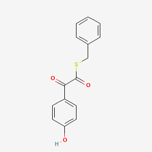 Benzeneethanethioic acid, 4-hydroxy-alpha-oxo-, S-(phenylmethyl) ester