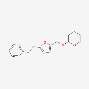 molecular formula C18H22O3 B12913986 2H-Pyran, tetrahydro-2-[[5-(2-phenylethyl)-2-furanyl]methoxy]- CAS No. 389622-39-3