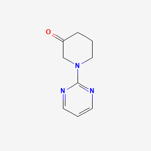 molecular formula C9H11N3O B12966323 1-(Pyrimidin-2-yl)piperidin-3-one 