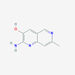 molecular formula C9H9N3O B12976747 2-Amino-7-methyl-1,6-naphthyridin-3-ol 