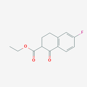 molecular formula C13H13FO3 B12986245 Ethyl 6-fluoro-1-oxo-1,2,3,4-tetrahydronaphthalene-2-carboxylate 