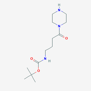 molecular formula C13H25N3O3 B13015348 tert-butyl N-[4-oxo-4-(piperazin-1-yl)butyl]carbamate CAS No. 1308650-47-6