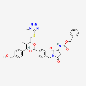 Benzyl (1-{[4-(4-[4-(hydroxymethyl)phenyl]-5-methyl-6-{[(1-methyl-1H-tetrazol-5-yl)sulfanyl]methyl}-1,3-dioxan-2-yl)phenyl]methyl}-2,5-dioxopyrrolidin-3-yl)carbamate