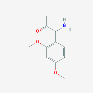 molecular formula C11H15NO3 B13052118 1-Amino-1-(2,4-dimethoxyphenyl)acetone 