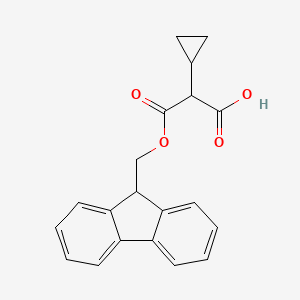 molecular formula C20H18O4 B13053471 2-(((9H-fluoren-9-yl)methoxy)carbonyl)-2-cyclopropylacetic acid 