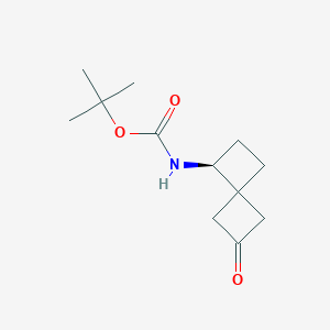 molecular formula C12H19NO3 B13069107 tert-Butyl N-[(1S)-6-oxospiro[3.3]heptan-1-yl]carbamate 