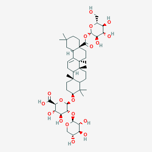 molecular formula C47H74O18 B13072321 (2S,3S,4S,5R,6R)-6-[[(3S,6aR,6bS,8aS,12aR,14bR)-4,4,6a,6b,11,11,14b-heptamethyl-8a-[(2S,3R,4S,5S,6R)-3,4,5-trihydroxy-6-(hydroxymethyl)oxan-2-yl]oxycarbonyl-1,2,3,4a,5,6,7,8,9,10,12,12a,14,14a-tetradecahydropicen-3-yl]oxy]-3,4-dihydroxy-5-[(2S,3R,4S,5R)-3,4,5-trihydroxyoxan-2-yl]oxyoxane-2-carboxylic acid 