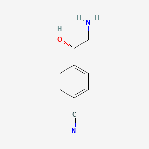 molecular formula C9H10N2O B13073684 4-[(1S)-2-amino-1-hydroxyethyl]benzonitrile 