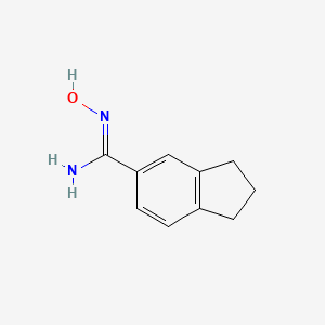 molecular formula C10H12N2O B13073788 N'-Hydroxy-2,3-dihydro-1H-indene-5-carboximidamide 