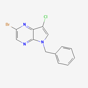 molecular formula C13H9BrClN3 B13111223 5-Benzyl-2-bromo-7-chloro-5H-pyrrolo[2,3-b]pyrazine 