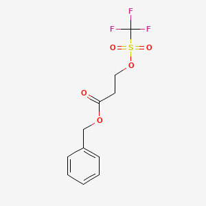 molecular formula C11H11F3O5S B13117341 Benzyl 3-(((trifluoromethyl)sulfonyl)oxy)propanoate 