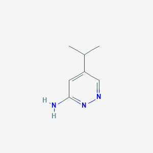 molecular formula C7H11N3 B13126910 5-Isopropylpyridazin-3-amine 