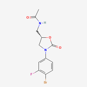 molecular formula C12H12BrFN2O3 B1312918 (5S)-N-[3-(4-溴-3-氟苯基)-2-氧代恶唑烷-5-基甲基]乙酰胺 CAS No. 856677-05-9