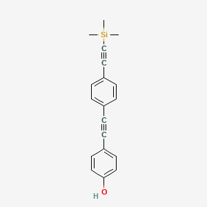 B1314781 4-((4-((Trimethylsilyl)ethynyl)phenyl)ethynyl)phenol CAS No. 910467-75-3