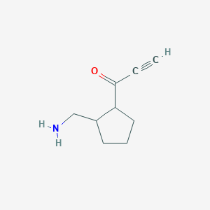 molecular formula C9H13NO B13150507 1-[2-(Aminomethyl)cyclopentyl]prop-2-yn-1-one 