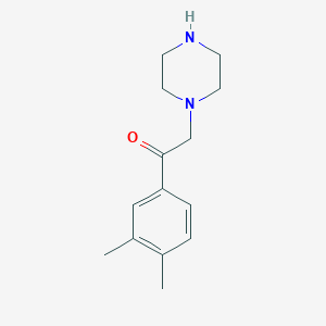 molecular formula C14H20N2O B13157633 1-(3,4-Dimethylphenyl)-2-piperazin-1-ylethanone 