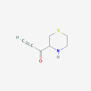 molecular formula C7H9NOS B13159128 1-(Thiomorpholin-3-yl)prop-2-yn-1-one 