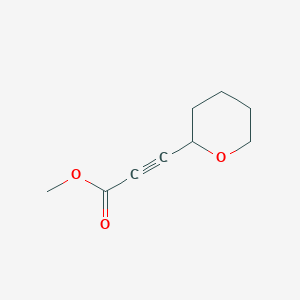 molecular formula C9H12O3 B13160290 Methyl 3-(oxan-2-yl)prop-2-ynoate 