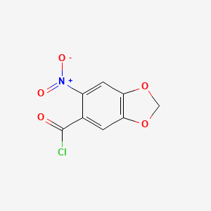 molecular formula C8H4ClNO5 B1317039 5-(氯)羰基-6-硝基-1,3-苯并二噁杂环 CAS No. 50425-29-1