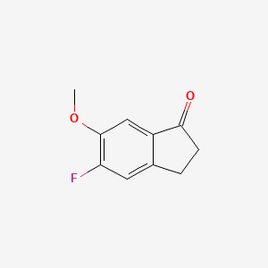 molecular formula C10H9FO2 B1317113 5-氟-6-甲氧基-2,3-二氢-1H-茚-1-酮 CAS No. 83802-71-5