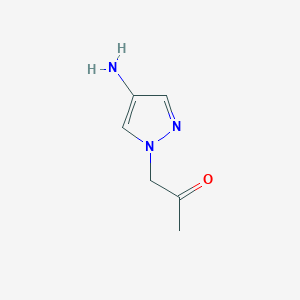 molecular formula C6H9N3O B13175483 1-(4-Amino-1H-pyrazol-1-YL)propan-2-one 