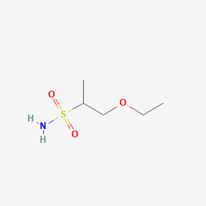 molecular formula C5H13NO3S B13175651 1-Ethoxypropane-2-sulfonamide 