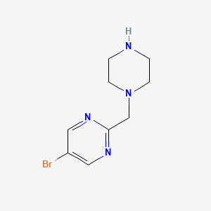 molecular formula C9H13BrN4 B13176519 5-Bromo-2-(piperazin-1-ylmethyl)pyrimidine 