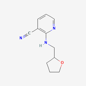 molecular formula C11H13N3O B1318353 2-[(Tetrahydrofuran-2-ylmethyl)amino]-nicotinonitrile CAS No. 945298-35-1