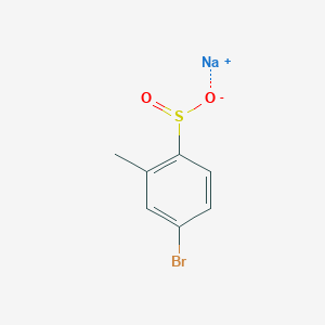 molecular formula C7H6BrNaO2S B13183932 Sodium 4-bromo-2-methylbenzene-1-sulfinate 