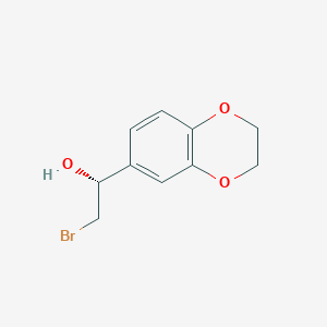 molecular formula C10H11BrO3 B13193834 (1R)-2-bromo-1-(2,3-dihydro-1,4-benzodioxin-6-yl)ethan-1-ol 