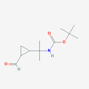 molecular formula C12H21NO3 B13194262 tert-Butyl N-[2-(2-formylcyclopropyl)propan-2-yl]carbamate 