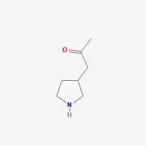 molecular formula C7H13NO B13198182 1-(Pyrrolidin-3-yl)propan-2-one 